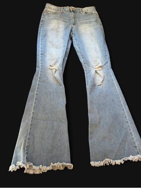 High-Rise Light Blue Flare Jeans with Distressed Knees